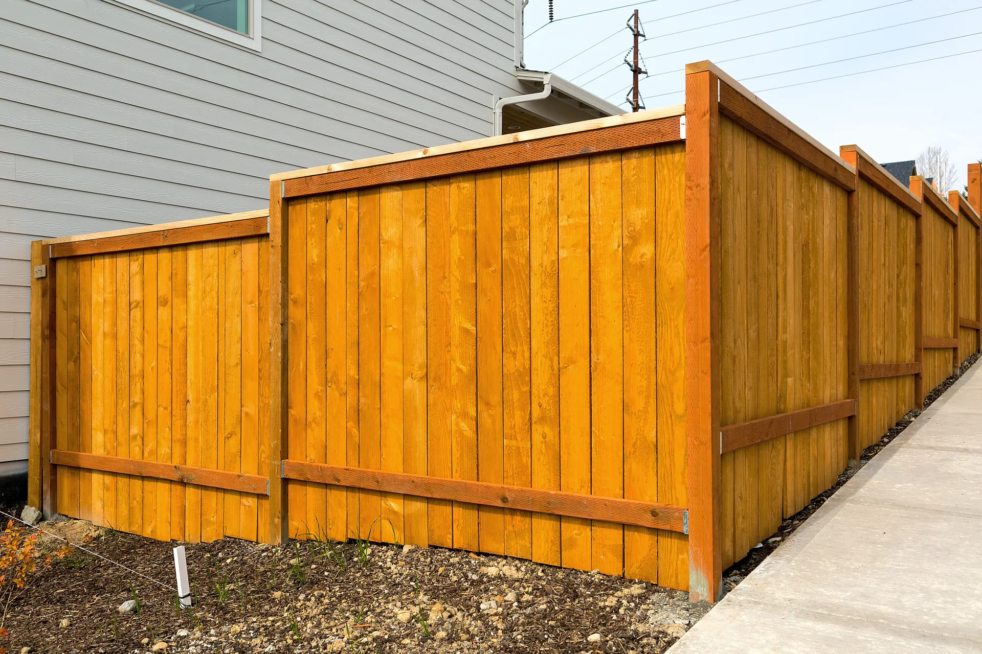 Cedar board-on-board privacy fence installed at a residential property