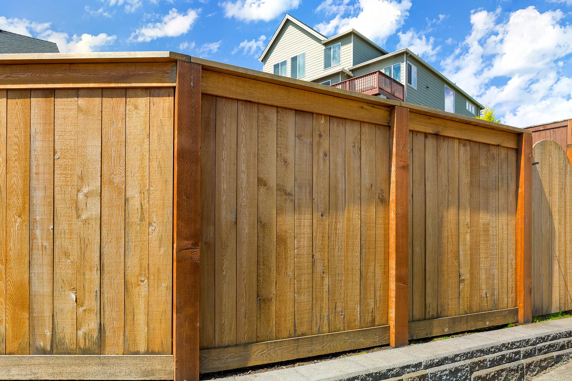 Stained wood privacy fence in a Charlotte residential neighborhood