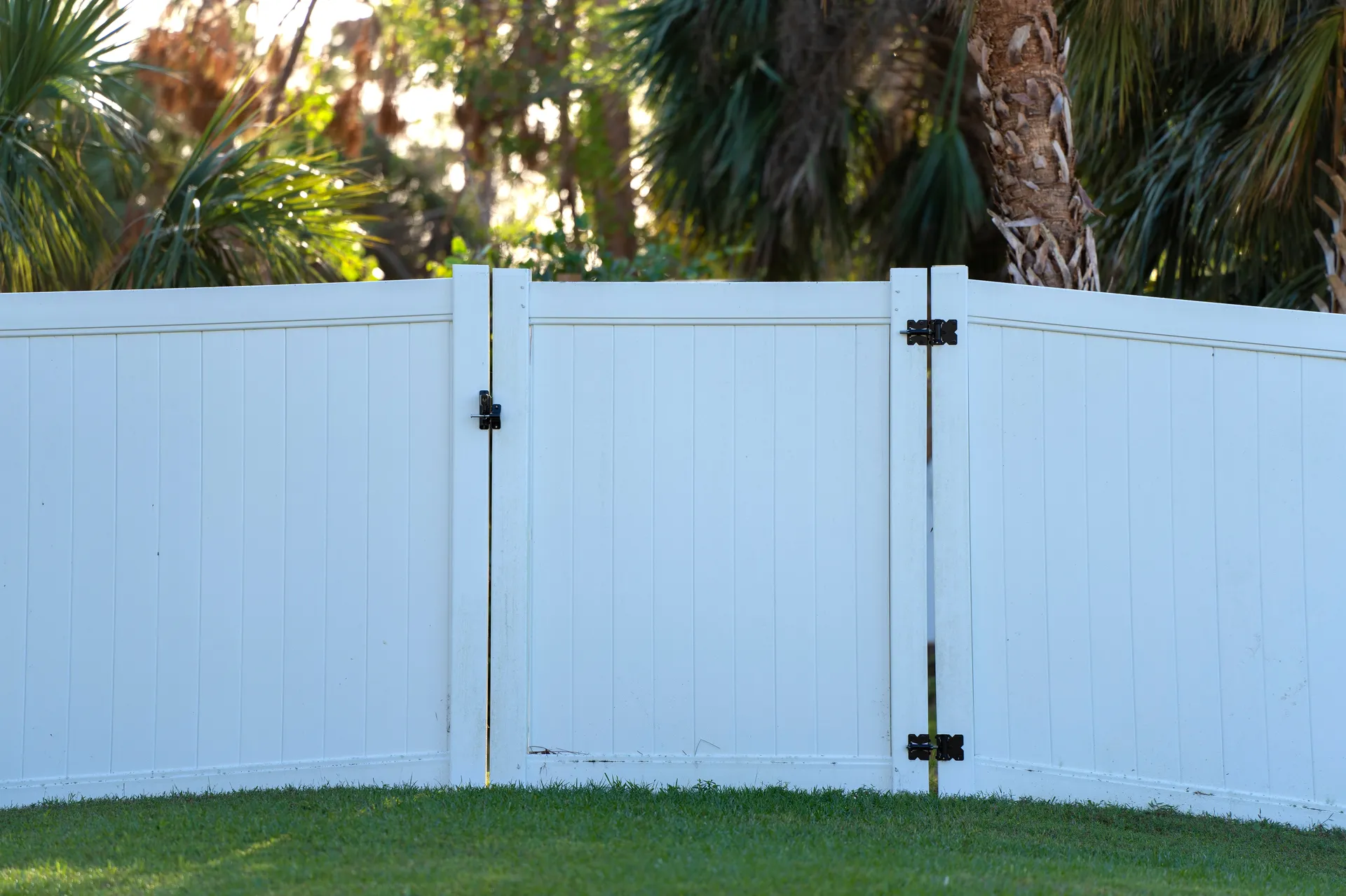White vinyl privacy fence gate with black hardware